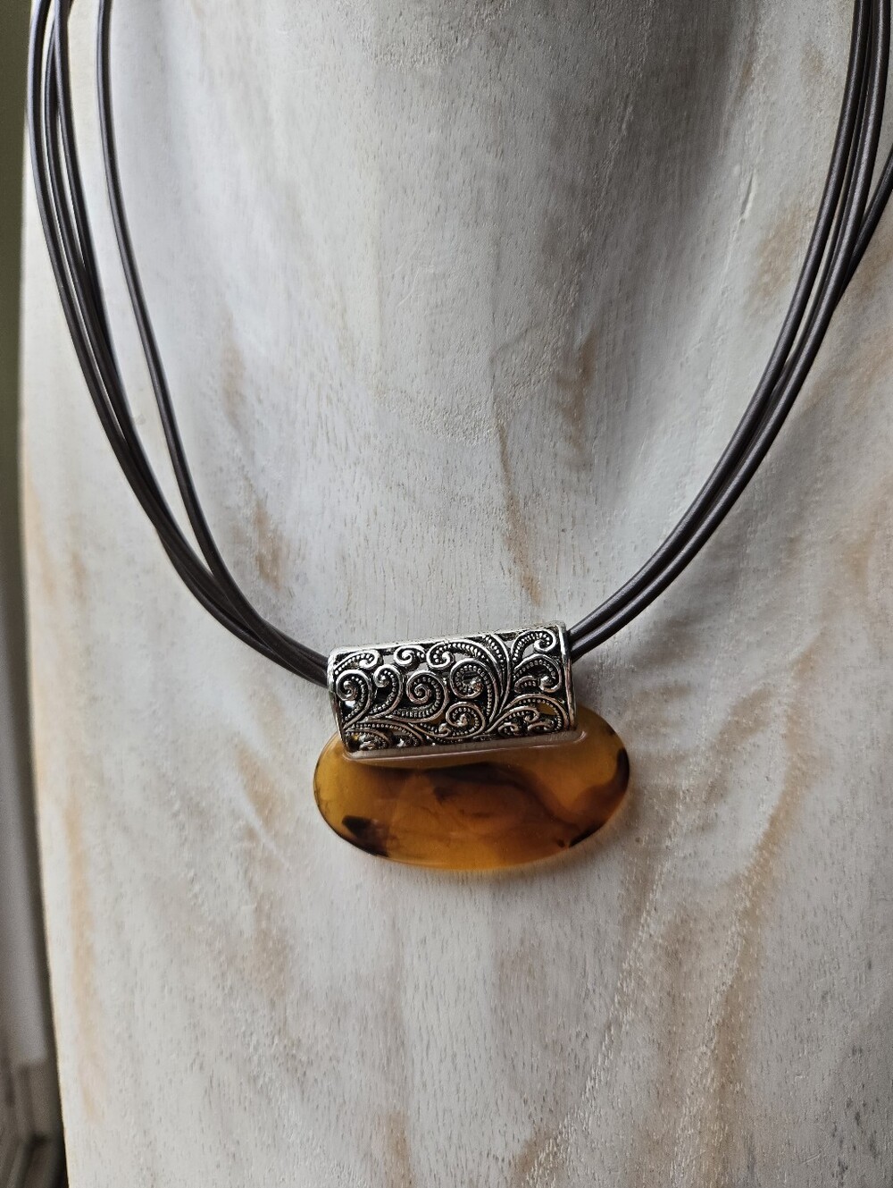 Amber Resin Pendant Necklace with Ornate Silver Accents
